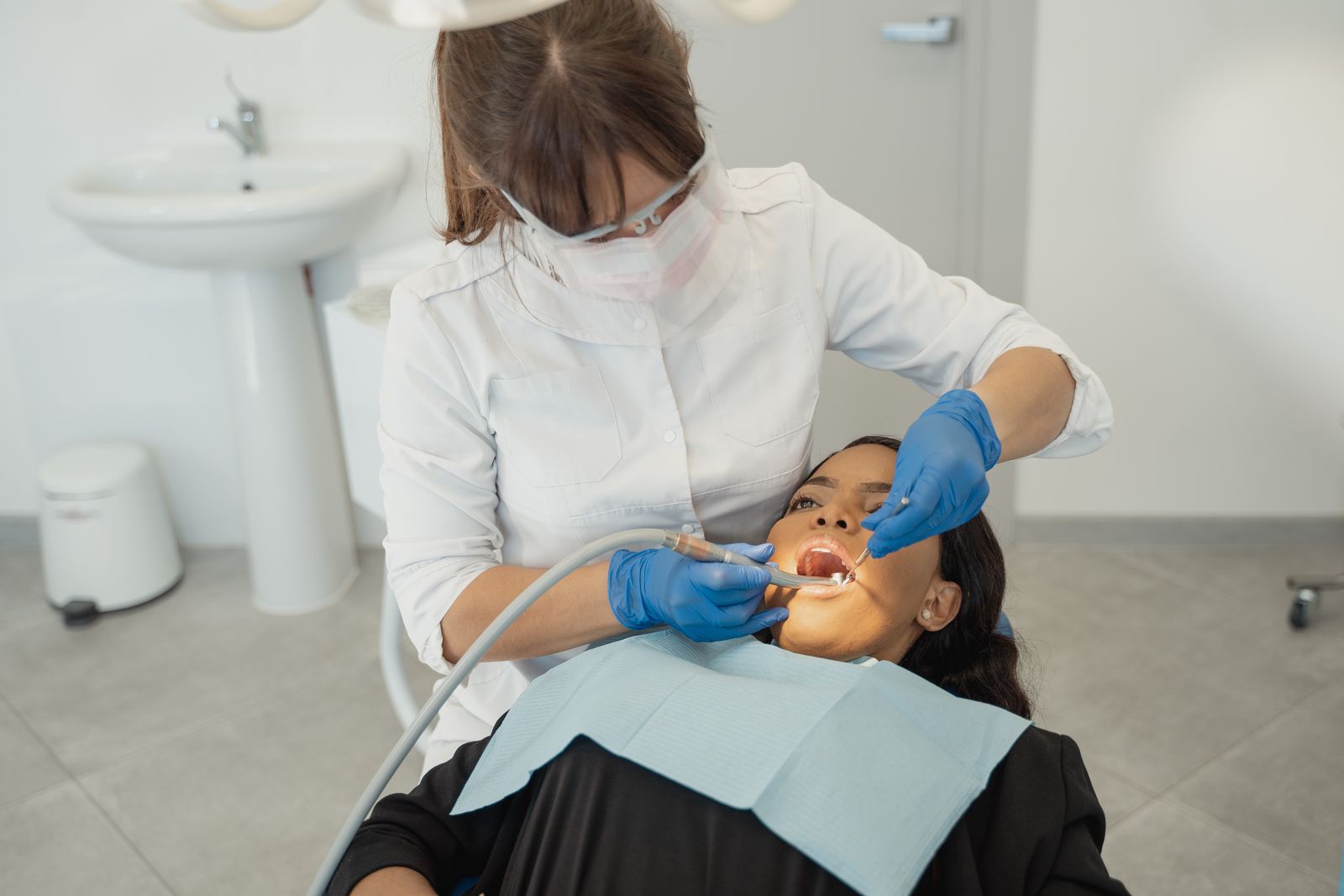 Dentist examining a patient's teeth at Northstar Dental Care