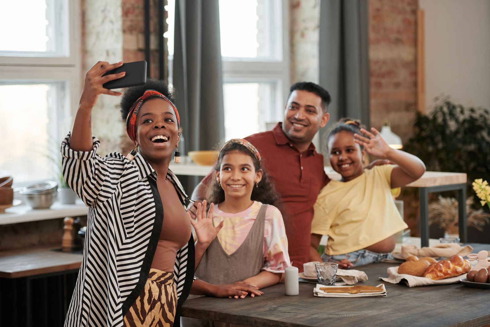 Family smiling together in a kitchen