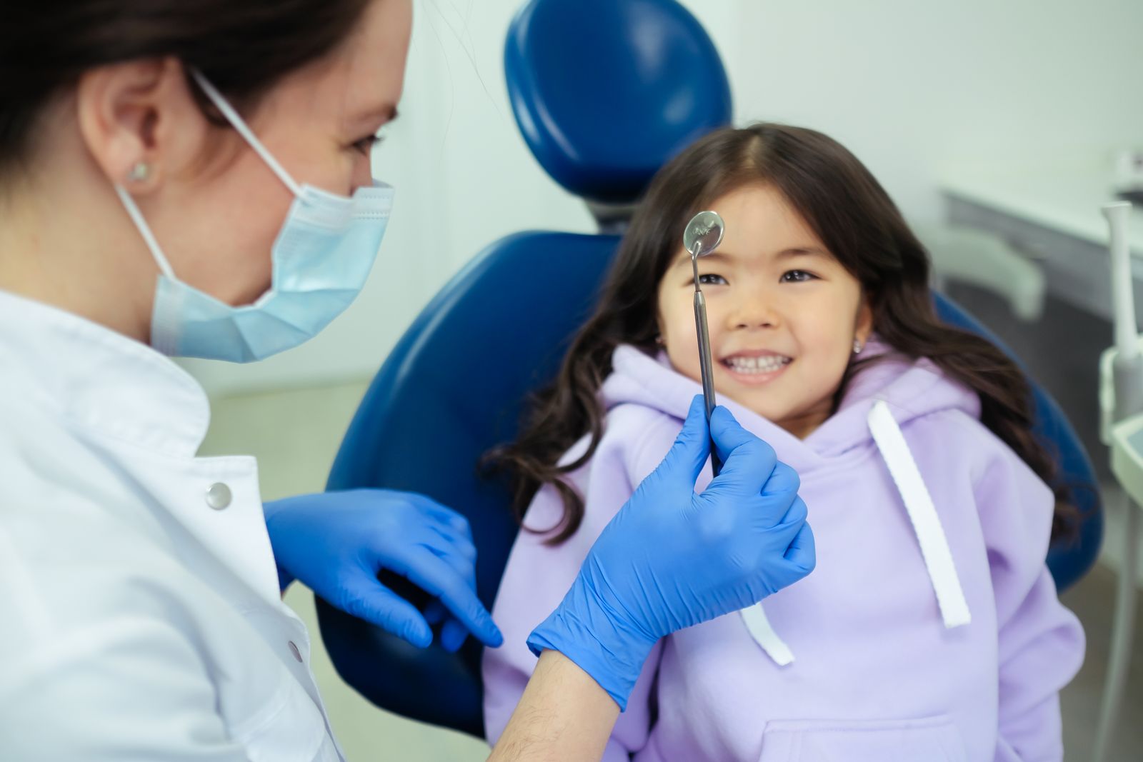Dentist and smiling child during a check-up